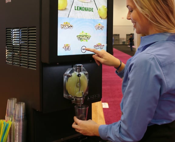 girl-using-dispenser@2x