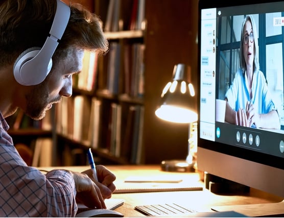 guy-taking-notes-from-video@2x