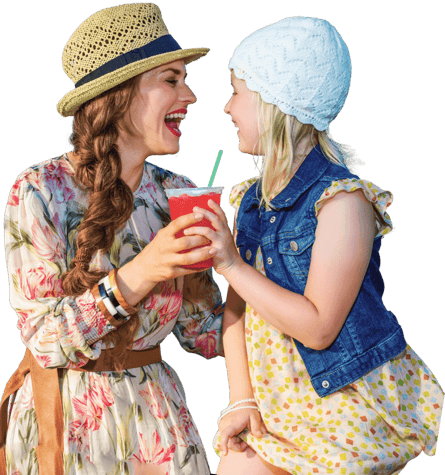 mom-and-daughter-laughing-while-holding-frozen-beverage-updated@2x