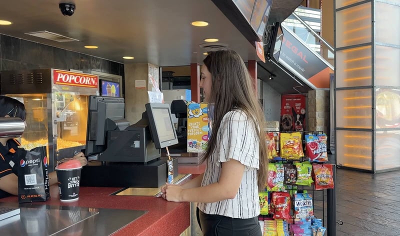 girl-buying-a-slushie-near-the-counter@2x