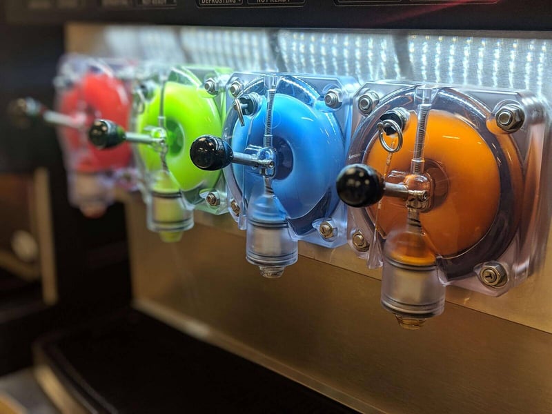 FBD Frozen. Frozen drink dispensers with different flavors and colors.