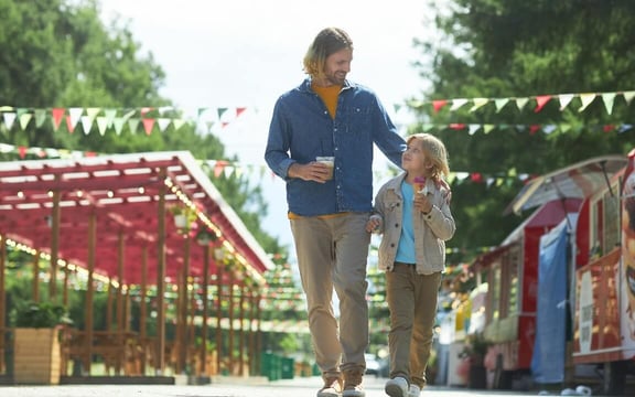 father-and-son-in-amusement-park@2x