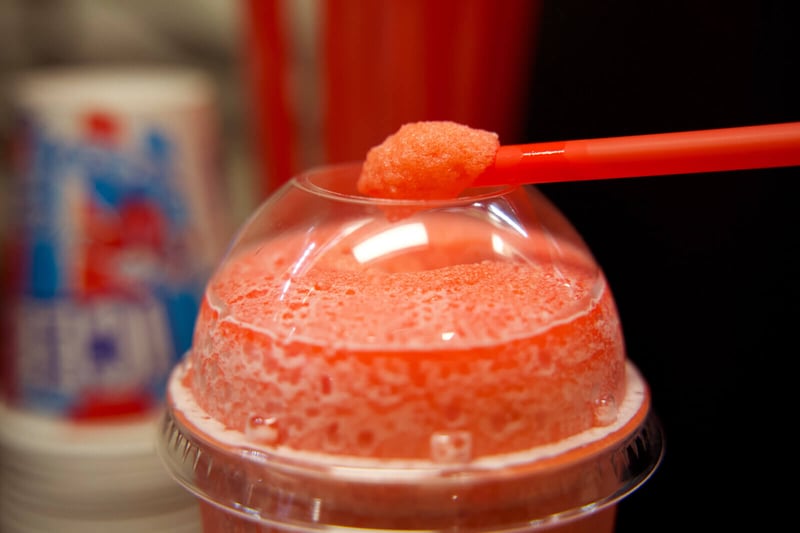 FBD Frozen. Red frozen carbonated beverage with straw.