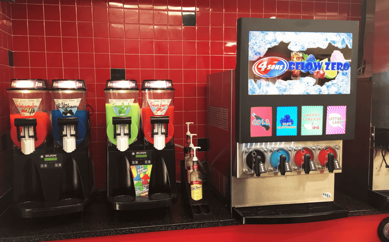 FBD Frozen. Granita machines on a counter next to frozen drink dispensers.
