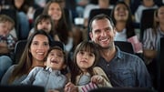 family of 4 at a movie theater